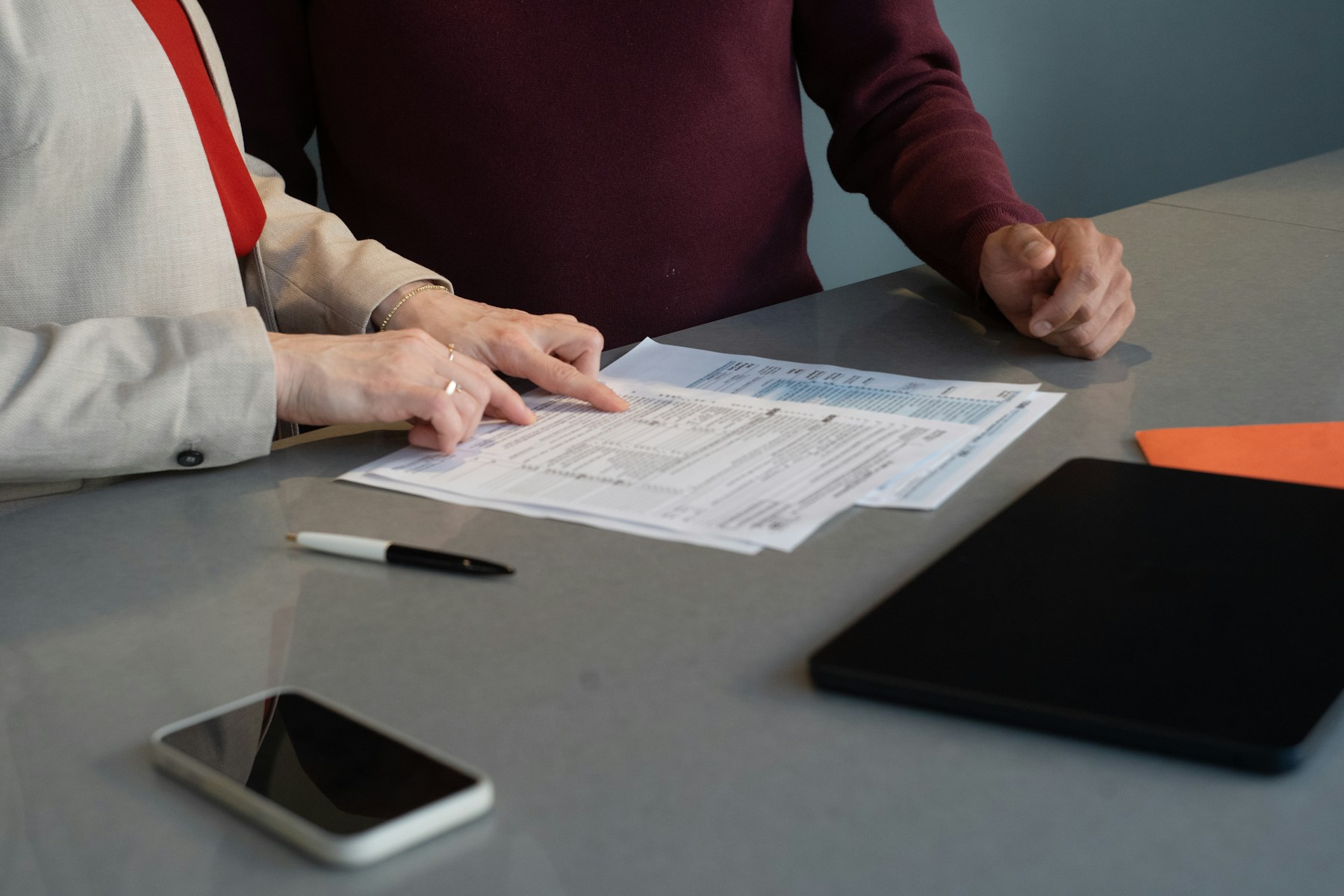 Professionals reviewing supplier quotations and sourcing documents